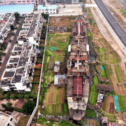 letsbuildahome-fr:  The Ship in the Field A derelict concrete ship called Gu Tian is seen at Mawei Economic Development Zone in Fuzhou, China. The ship has been stranded for more than 30 years. Built in the 1970s, it is the largest cement ship in the