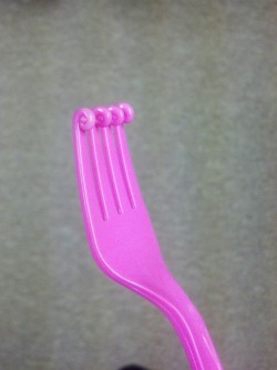 smooshface:  My sister melted a pink plastic fork. She named the outcome Wanda 