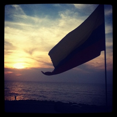 Regards From Colombia
The sunset as seen from Cartagena’s old city. Dude by the ocean is casting a line.