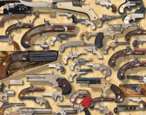A large assortment of antique pocket pistols.