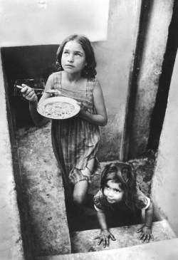 Refugee children in a filthy cellar at Piraeus