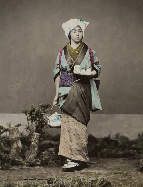 Hand-colored photo of young Japanese woman, ready to serve tea.  Japan, 1880&rsquo;s. Photo