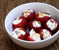ksmgilbreath:  Strawberries filled with greek yogurt, and topped with almonds. Omg. Im dying. Looks so good. I need to go buy all of this STAT 