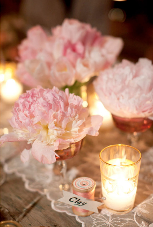 Rustic Barn Wedding: A chandelier in a barn makes for a elegant focal point