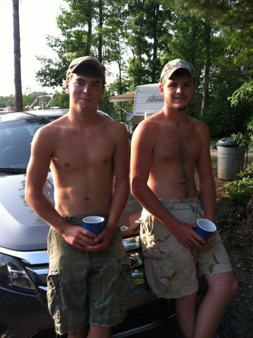 Straight shirtless southern boys drinking at a campground. 