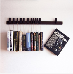    The book rack comes in solid Wenge, with a set of 12 pins/bookmarks. The pins are detached and can be moved around the back piece to meet your needs at each time. The books rest on a small wooden plate so the pages stay intact. The plates can be moved