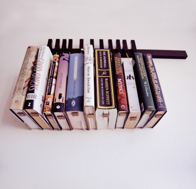    The book rack comes in solid Wenge, with a set of 12 pins/bookmarks. The pins