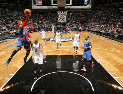 siphotos:  Carmelo Anthony swoops in for a layup during Monday’s New York City matchup of the Knicks and Nets. Anthony scored 34 points but the Nets prevailed in overtime 96-89. (Nathaniel S. Butler/NBAE via Getty Images) MANNIX: Nets win battle, but