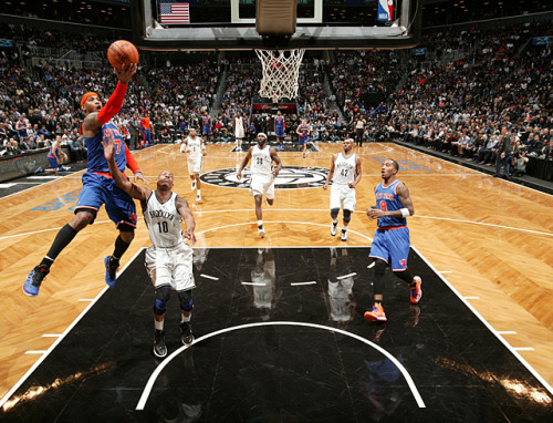 siphotos:  Carmelo Anthony swoops in for a layup during Monday’s New York City matchup of the Knicks and Nets. Anthony scored 34 points but the Nets prevailed in overtime 96-89. (Nathaniel S. Butler/NBAE via Getty Images) MANNIX: Nets win battle, but