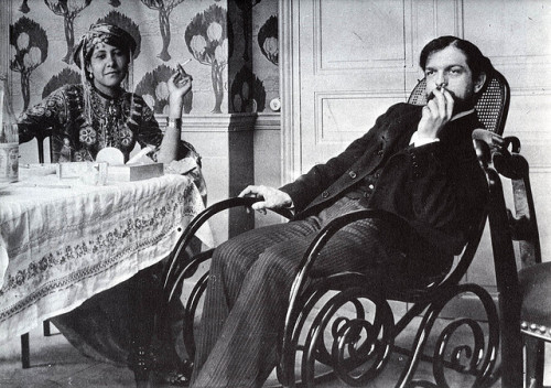 Debussy with Zohra ben Brahim, 1897, at the house of their friend the erotic poet and photographer Pierre Louÿs. Louÿs brought Zohra to Paris from Algeria as a kind of muse, and, well… “We are stuck together like two dogs in the street,” he had...