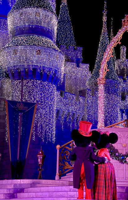 disneyforeverlives:Mickey and Minnie Admire Cinderella Castle at Christmas by Tom.Bricker on Flickr.