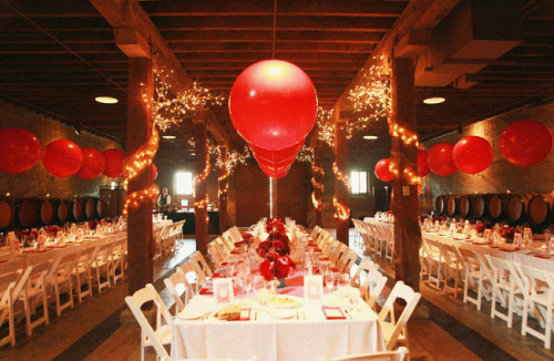 Barn Style Wedding: Decorated with large helium filled balloons along with branches and drapes wrapp