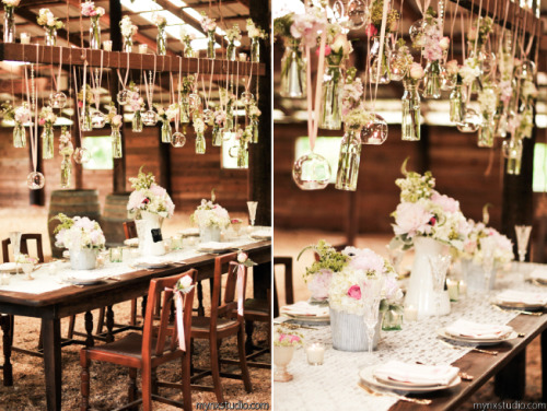 Suspended Wedding Centerpieces: Pink ribbon and twine suspend flowers in vases and candles in glass 