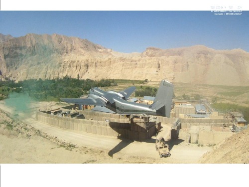 DHC4 Caribou does a resupply drop at New Zealand PRT COP Romero in the Kharmard, Bamyan province.  O