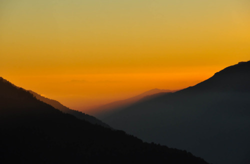 The sun setting over the hills. View from Hotel Red Panda in Sing Gompa, Rasuwa, Nepal. Photography 