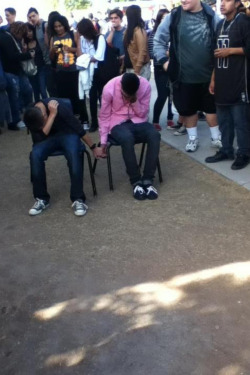  These two guys at my school got into a fight after 1st hour and they were either to get suspended for 9 days or sit in the school courtyard holding hands all day even during classes. You can see what they decided. 