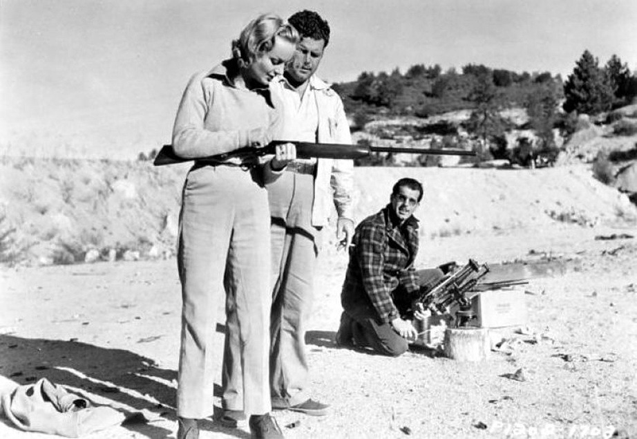 Carole Lombard, writer Claude Binyon and Fred MacMurray go skeet shooting during