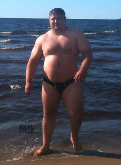 real-thick:  Big guy in speedo. Built like