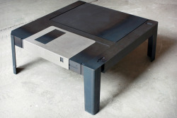 freekahzoid:  inspirezme:  Was there anything more entertaining as pulling back that metal slip on a floppy disk and letting it fling shut? This Floppy Disk Table will remind you of the good old days whenever you sit down in front of your TV. Slide the