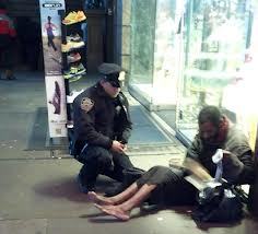 NYPD officer buys homeless man a pair of boots - an angel at work