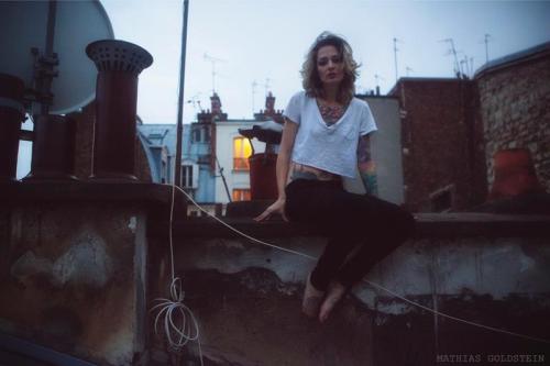 Sitting on a Paris rooftop. Twilight. photo Mathias Goldstein, model Theresa Manchester This was a few minutes before I slipped and slid down the roof on my belly leaving a looooong vertical scratch hahah :)