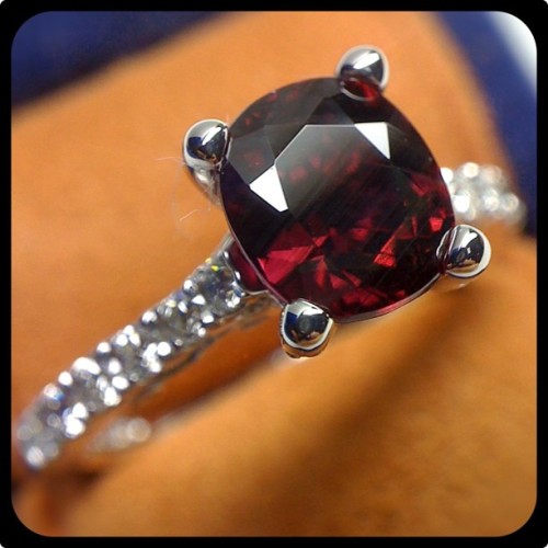 Perfect engagement ring for the holiday season; Insignia-7054 set with a deep red Garnet.