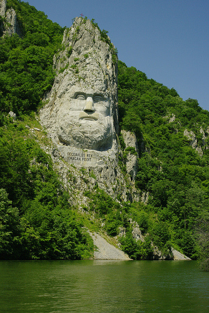 King’s Decebal face carved in rock on the shores of Danube River, Romania (by toma_rig).