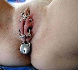 amelia731:  thebillgod:  pussymodsgalore:  Barbells, flesh tunnels and rings, even a padlock, there’s no way in! Chastity piercing.   All I can say is wow.  Devotion    Buttslut 