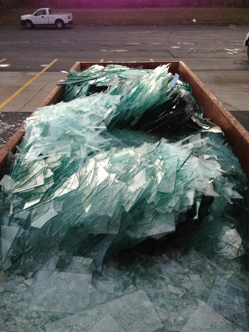 insooutso: Recycling dumpster full of failed glass designs. Looks glacial.