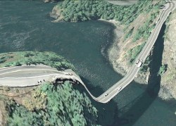   Postcards From Google Earth “The images are screenshots from Google Earth. They are glitches that occur when the 2d satellite imagery and 3d terrain don’t line up quite right, or structures such as bridges get projected down onto the terrain below,