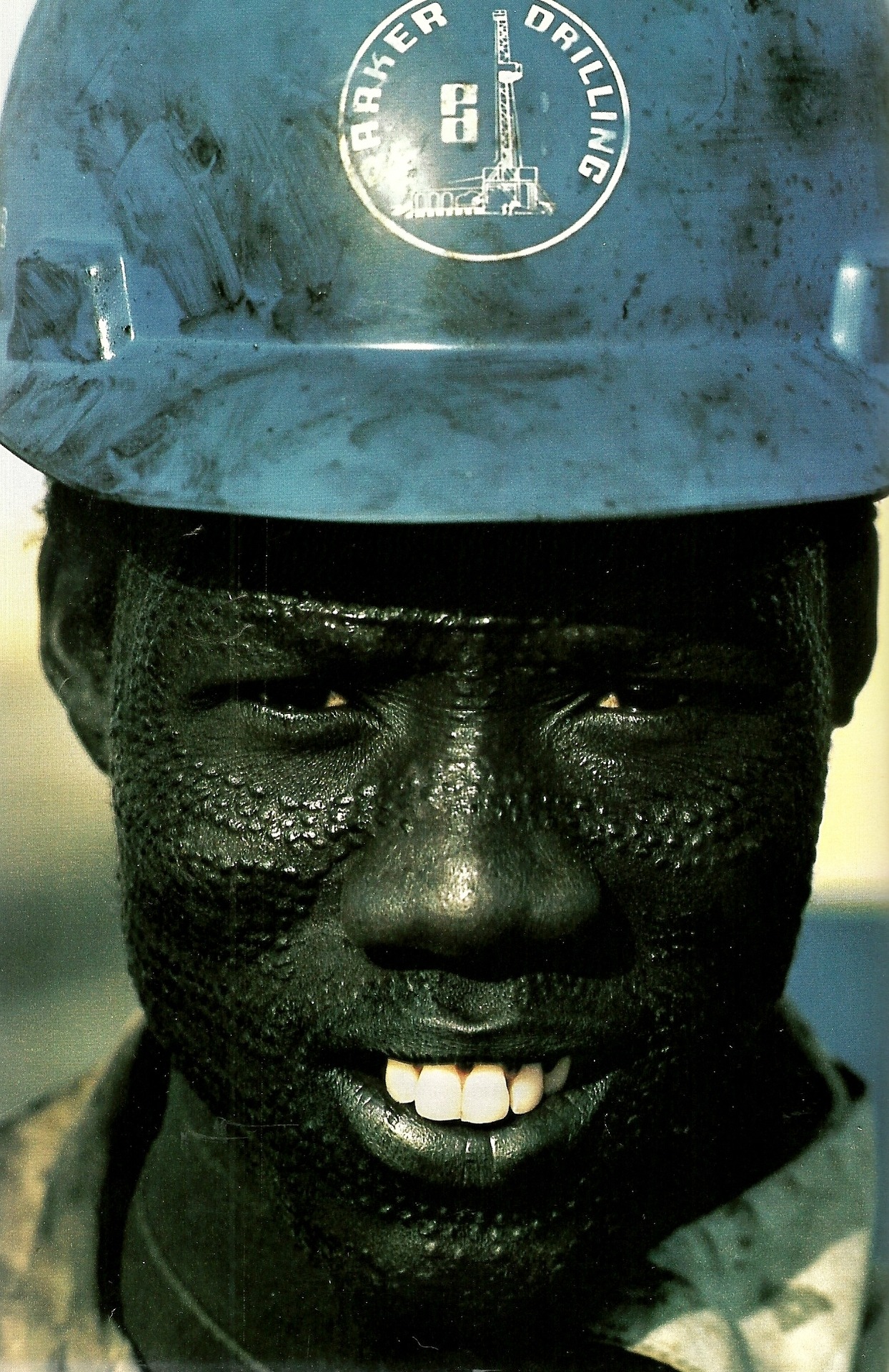 vintagenatgeographic:  Nuer tribesman wears a hard hat for his job on an oil rig