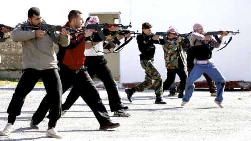 Syrian SquadA group of Syrian rebels with their individual AK rifles, doing some sort of training ex