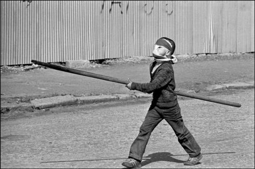 collective-history:  A small boy prepares to take on the British army with a home-made lance in Belfast, 1981, by Ian Berry 