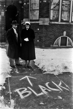 itsjohnsen:  A couple who’d moved into an all-white neighbourhood looks at graffiti scrawled in front of their home. Chicago, 1957. Francis Miller 