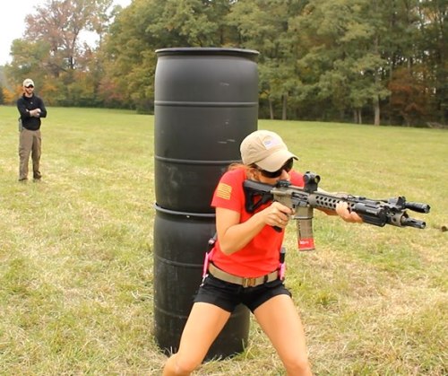 Girls shooting guns at range