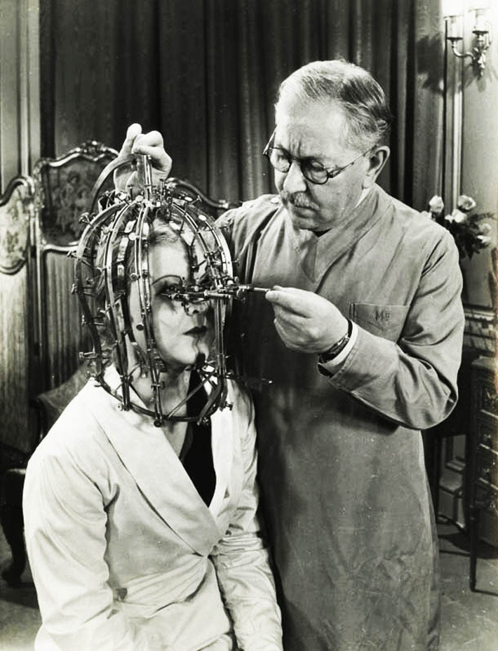 Max Factor demonstrates his scientific device the Beauty Micrometer which detects