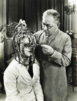 Max Factor demonstrates his scientific device