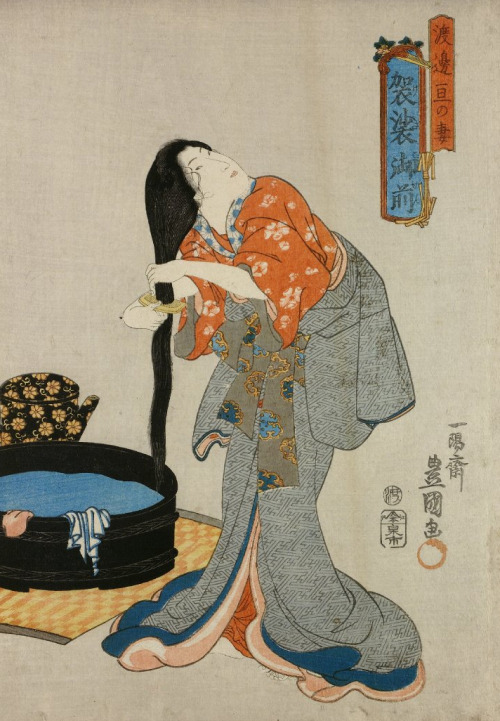 Folktale ukiyo-e woodblock print depicting Kesa, wife of Watanabe dressing her long hair in preparat