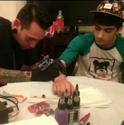 paulways-watching-1d:  Zayn and Louis getting more ink.. (not sure when they are from)