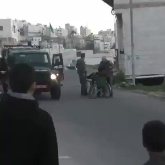 kufiyah:  An Israeli soldier was recorded assaulting a wheelchair-bound Palestinian man by pushing him to the ground, making his head hit the pavement. Several Palestinians tried to approach to help, but another Israeli soldier stops them by pointing