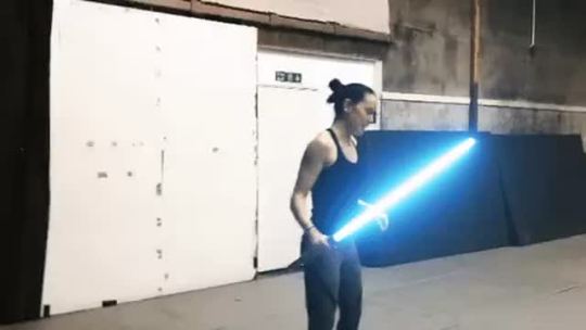gif87a-com:  Daisy Ridley practicing with a light saber. 