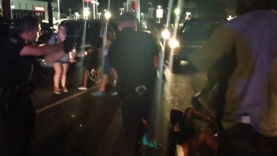 storyofagayboy:  VIDEO: Black Lives Matter protesters take back woman being detained by police with guns drawn in Baton Rouge, Louisiana on Friday night. Via Bryn Stole  