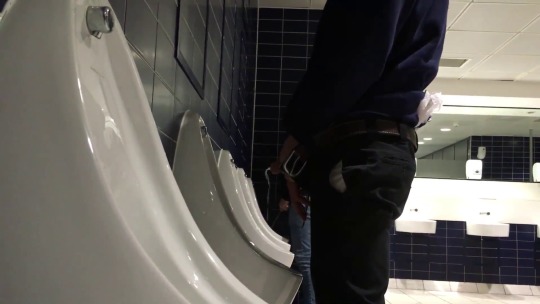 theguysspy:  Hung lad enjoying having a piss at the urinals