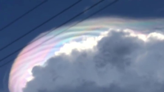 aestheticalspace: Iridescent clouds, looking like a rainbow in the clouds. A diffraction phenomenon caused by small water droplets or small ice crystals individually scattering light. Larger ice crystals do not produce iridescence, but can cause halos,