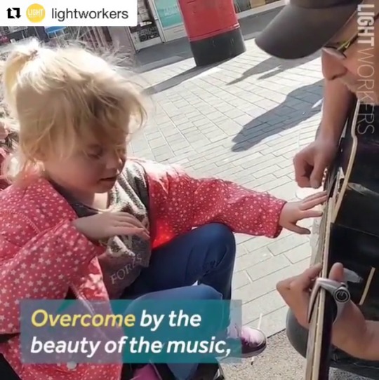 klubbhead: butterflyinthewell: A busker plays music for a blind autistic girl sitting in a wheelchair. She’s being allowed to stim (flapping and rubbing her shirt) and respond to the music her own natural way. The busker places her hand on the guitar