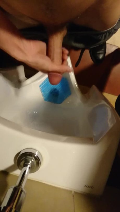 sprayingcum:  Shooting a quick load into a public Urinal. 
