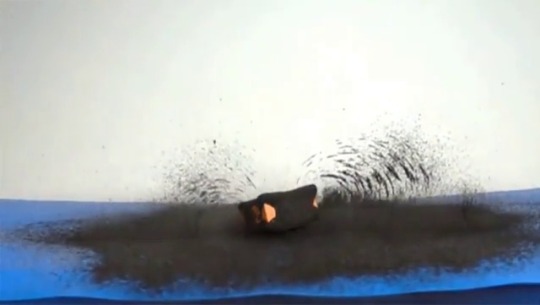 sixpenceee:  A magnet bouncing on a trampoline with iron filings, showing its magnetic field.