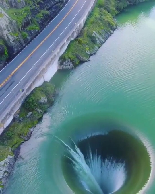 whollyunnecessary:  tangentqueenofdragons:vizual-vibe:allwildernessThe “The Glory Hole” at the Monticello Dam in Lake Berryessa, California, came in handy earlier this year for the first time in a decade due to the heavy rains California had. The