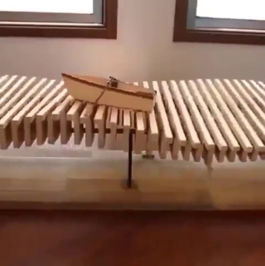 blondebrainpower:Kinetic wave sculpture, made from wood, each wave is driven by a cam that moves the wave both horizontally and vertically.    Made by Ross McSweeney