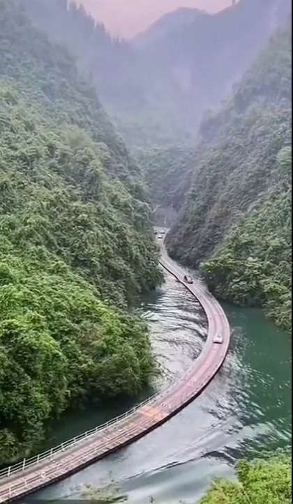 ninjaduckpirategoose:  sixpenceee:   Pontoon road in China that floats on and follows the river.  Source                              Nope 